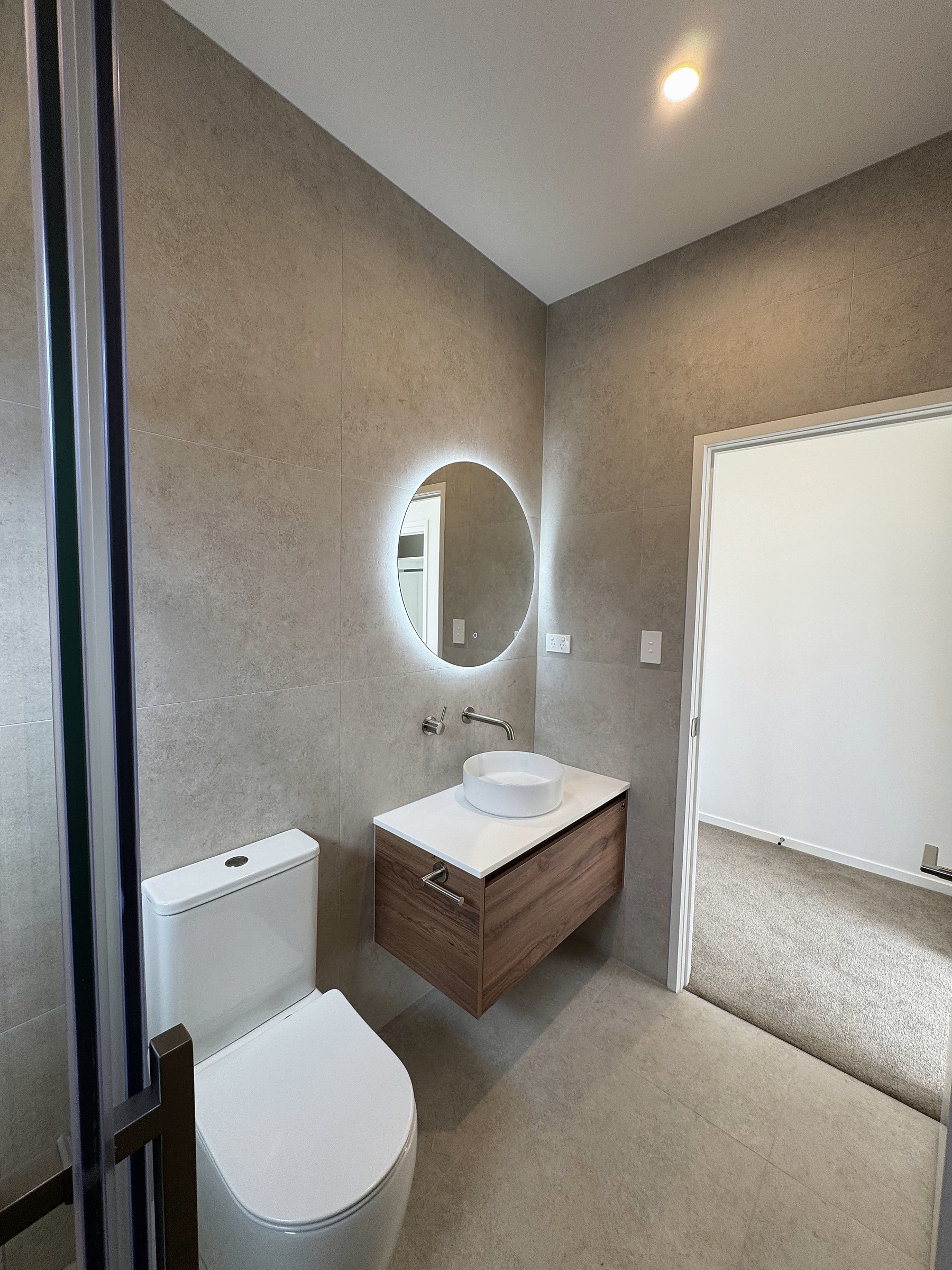 Timber vanity and illuminated mirror in House 44