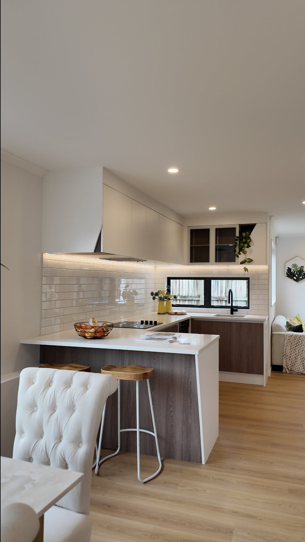Finished townhouse kitchen with breakfast bar and timber flooring